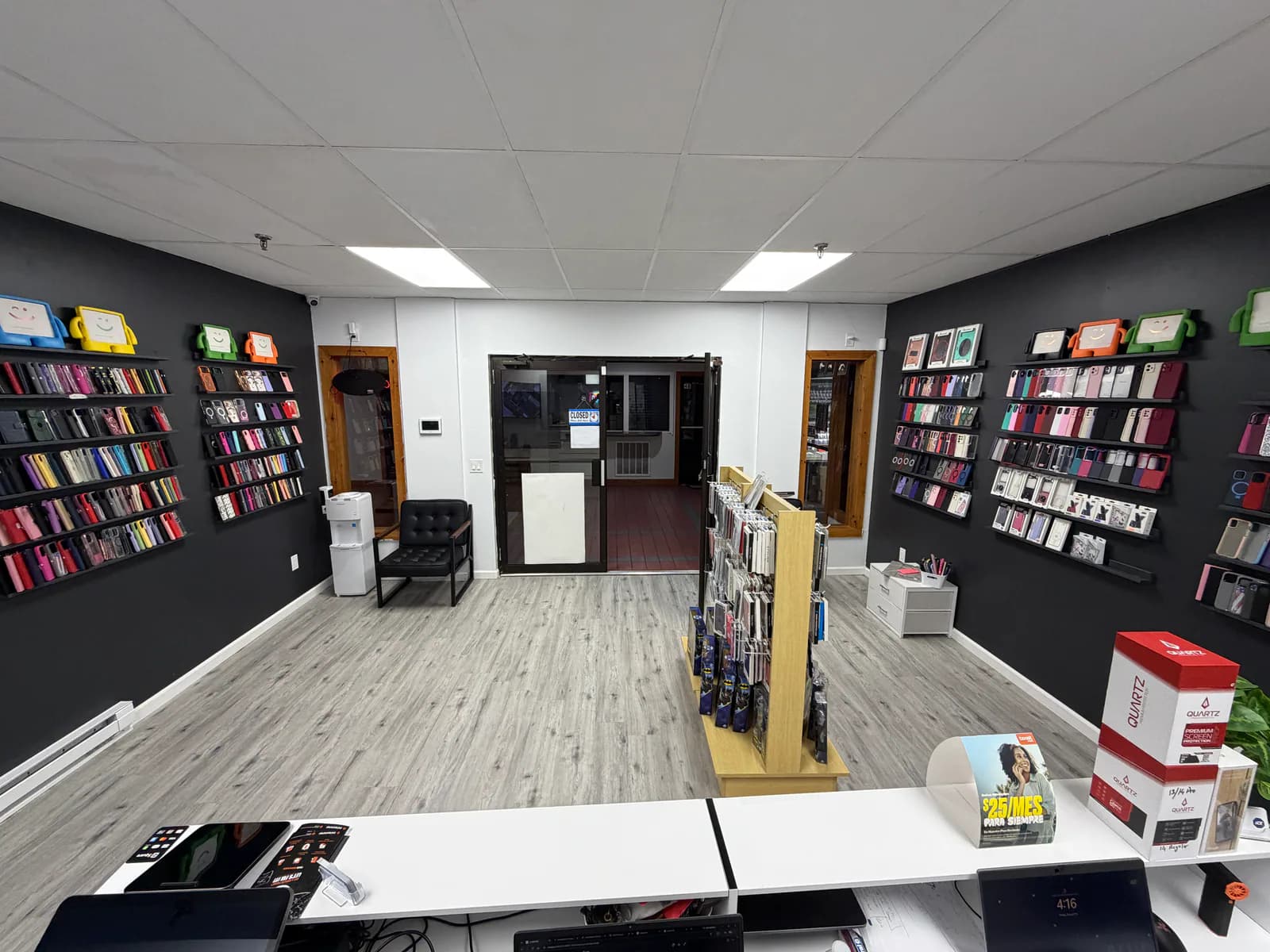 Interior of Hackettstown Phone Repair with device cases and the Main Street entrance